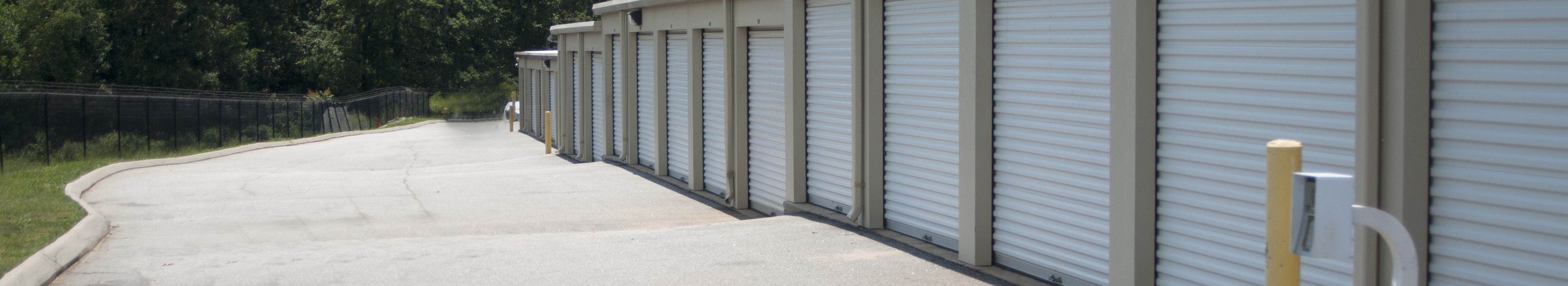 Outside view of storage units with roll up doors at The Storage Vault Greer, South Carolina