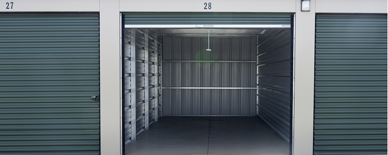 view of storage units with green doors wide angle view 