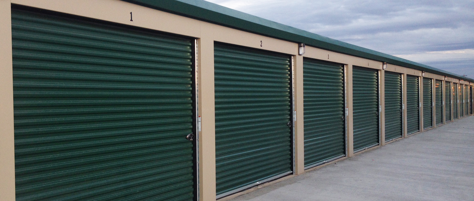 view of storage units with green doors wide angle view 